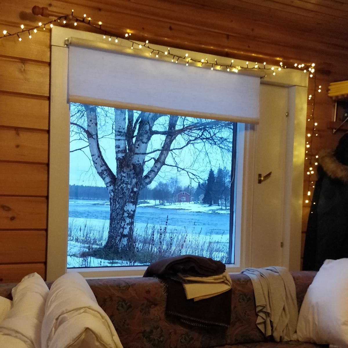 LivingRoom-with-a-view-Finnish Lapland: drawing studio in Lapland, with a beautiful view outside. The landscape inspired me to draw 'Small Village', artwork by Aurealis Creatief